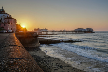 Cromer beach and pier at sunset